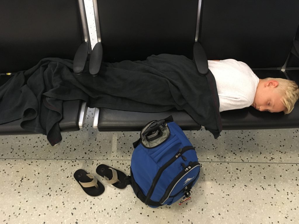 Kid sleeping in airport