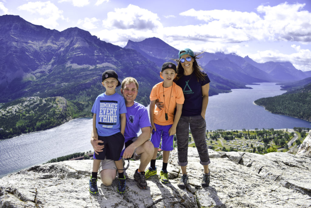 Family on top of Bear's Hump, Waterton, Alberta, Canada