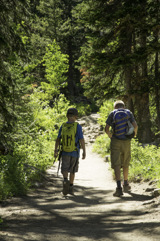 Kids hiking Inspiration trail, Grand Tetons National Park