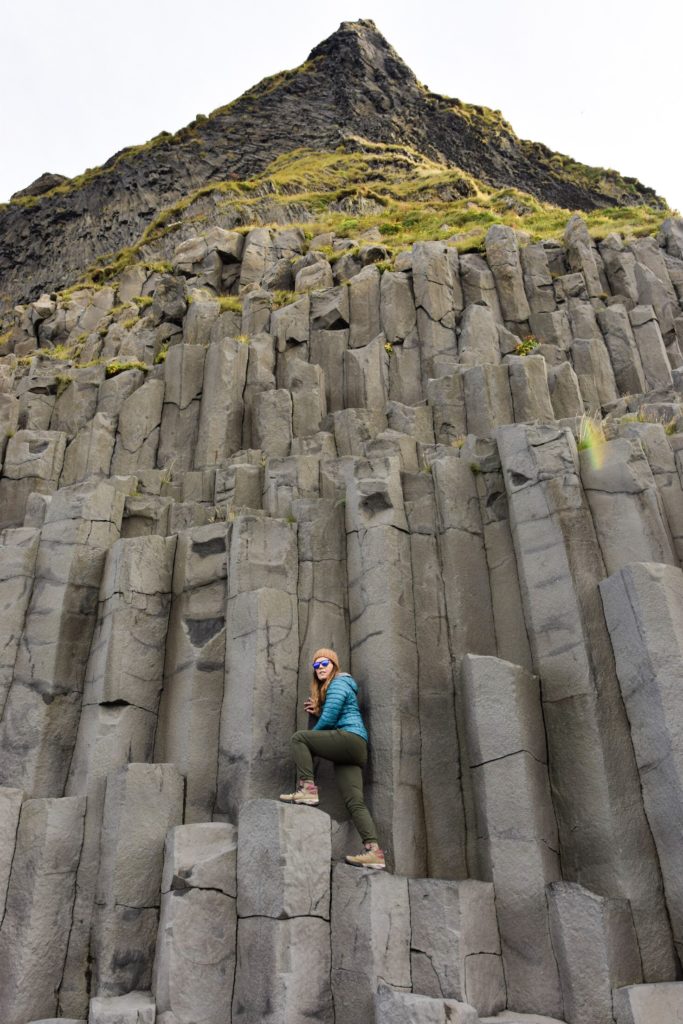 Climbing up the basalt columns at Reynisdranger Beach, Iceland
