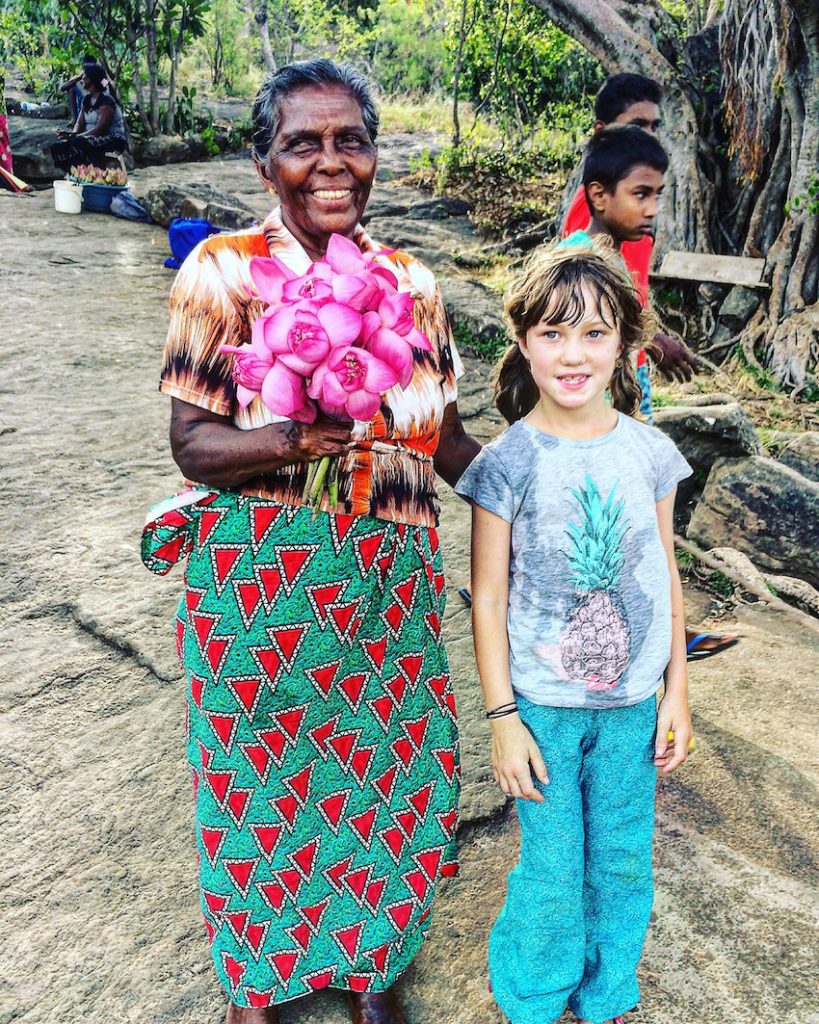 Sri Lankan local with lotus flowers