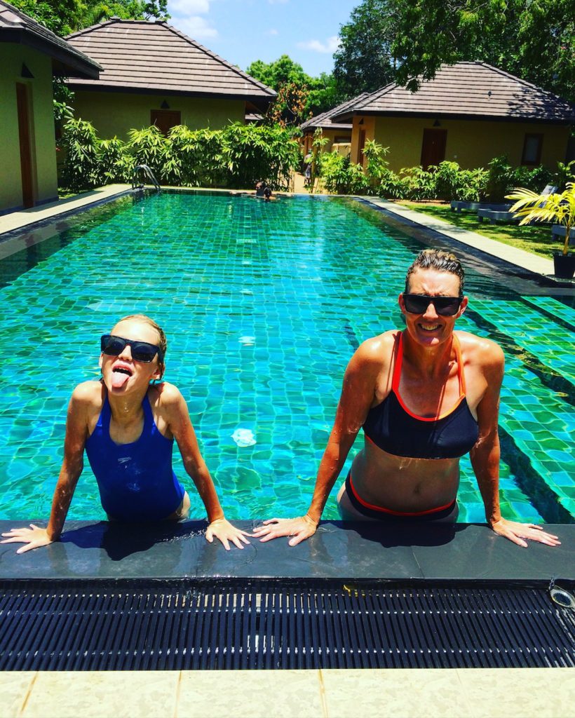 Mom and kid at Sri Lankan hotel pool