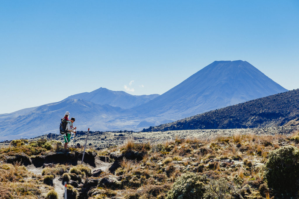 Family hiking through Tongariro National Park New Zealand