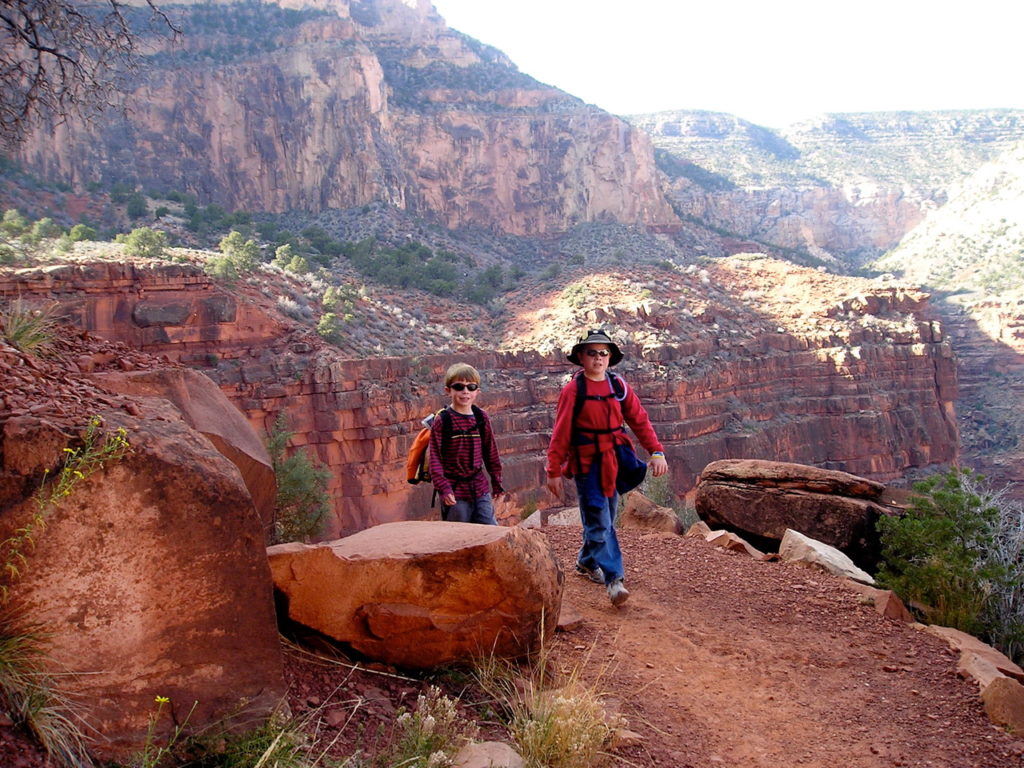 Kids hiking Rim trail at Grand Canyon National Park, Arizona