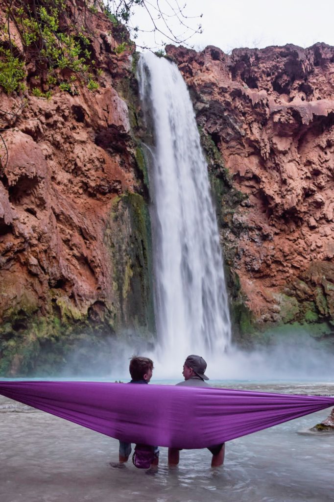 Kids in hammock at Mooney Falls, Havasupai, Arizona