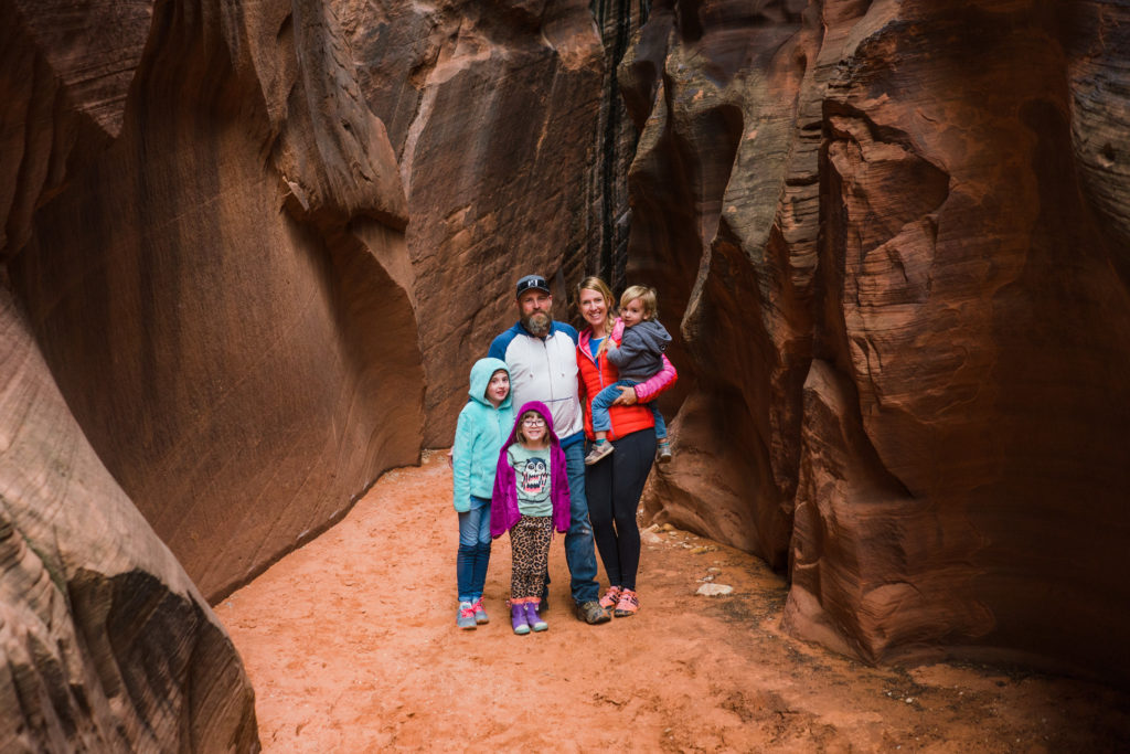 Family in slot canyon of Southern Utah