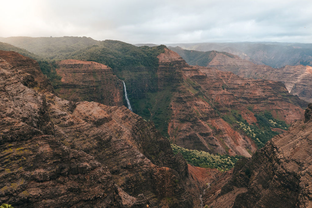 Waterfall in distance of Waimea Canyon, Kauai, Hawaii