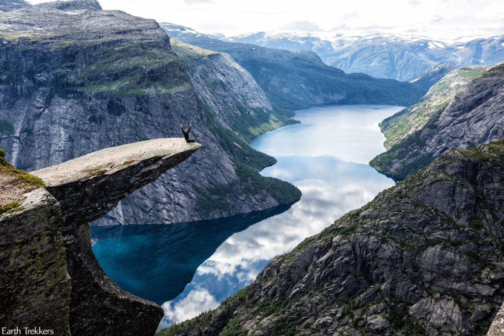 Man perched on rock at Trolltunga, Norway