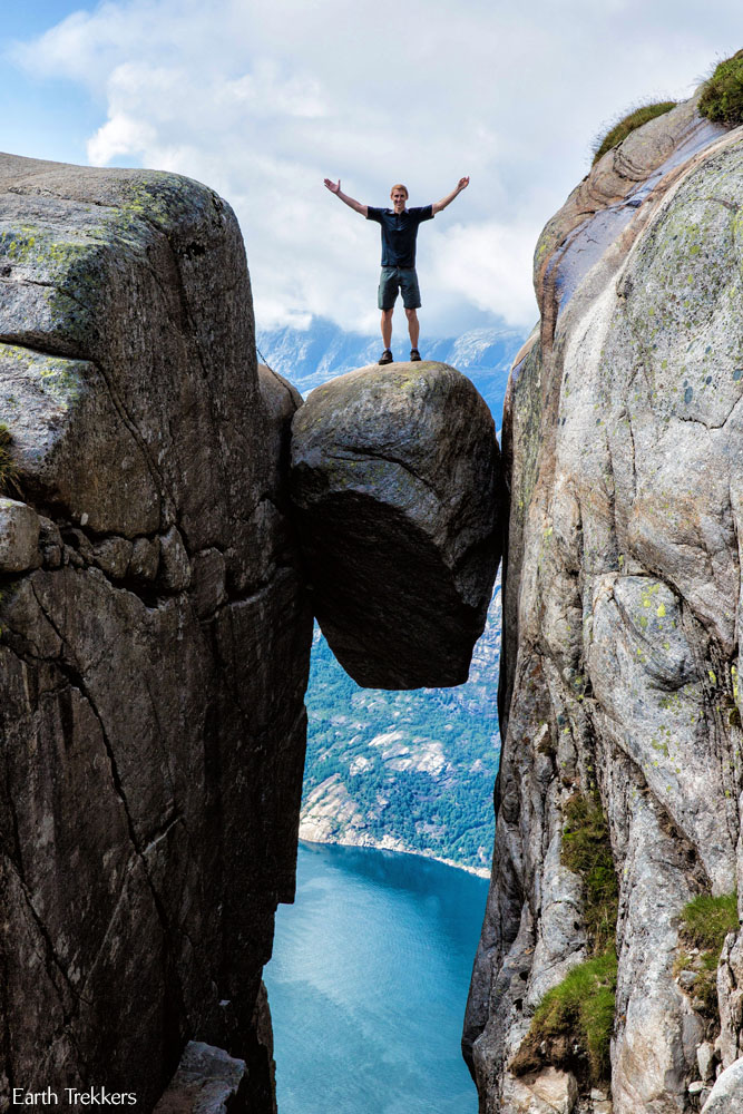 Man standing on rock on Kjeragbolten hike, Norway