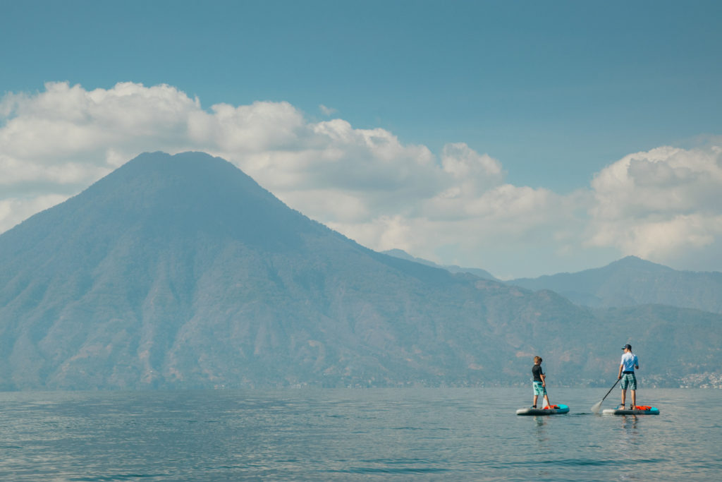 Paddleboarding on Lake Atitlan, Guatemala with Volcano San Pedro in backdrop