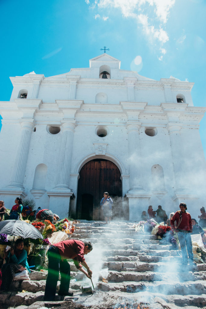 Burning incense and giving offerings at the church in Chichicastenango, Guatemala