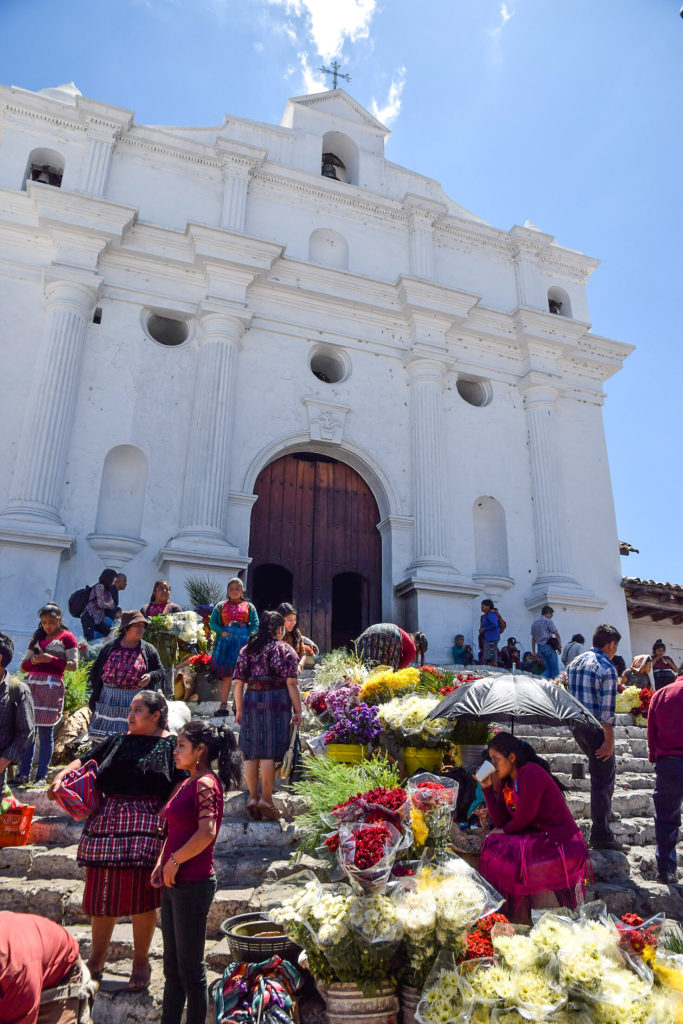 The famous steps of the church in Chichcastenango, Guatemala where women sell flowers and locals come to burn incense and give offerings