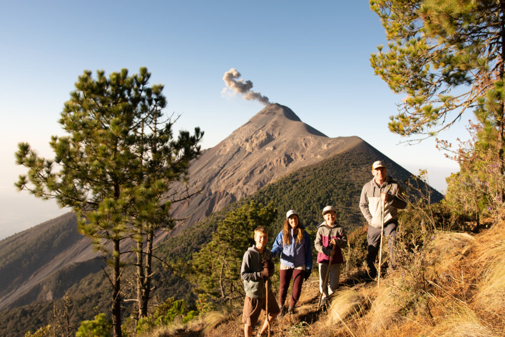 Family on Acatenango overlooking Volcano Fuego, Guatemala