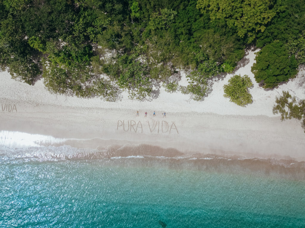 Aerial photo of Playa Conchal with Pura Vida written in sand
