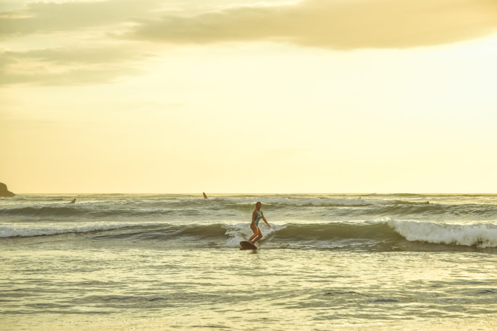 Surfer girl at Playa Grande, Costa Rica