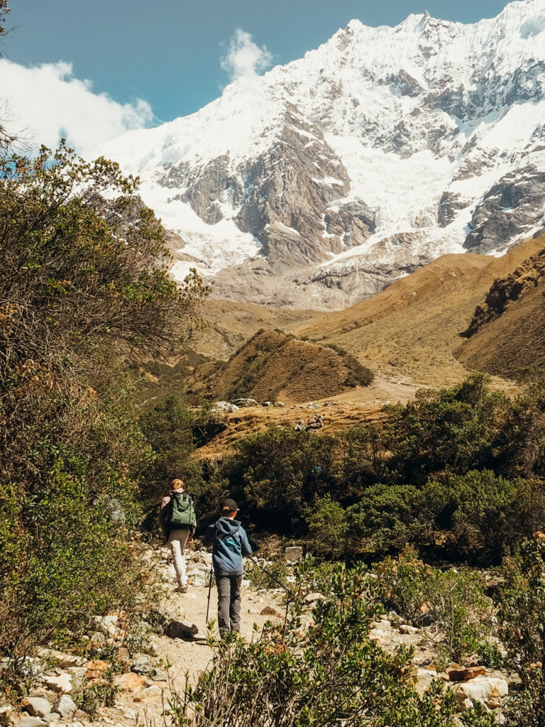 People hiking on trail to Humantay Lake, Peru