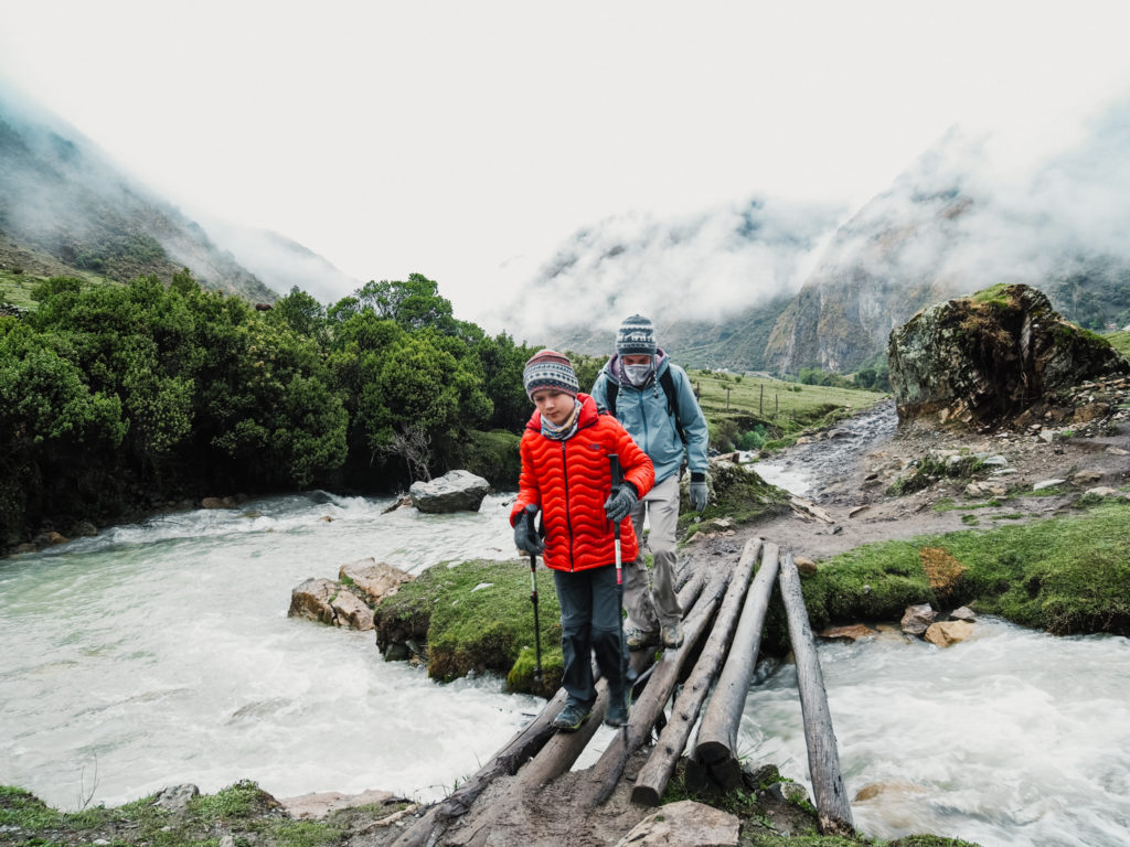 Boys hiking up the trail to Salkantay Pass, Peruvian Andes, Peru